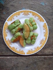 Kue Pukis, Traditional Javanese half-moon shaped pancakes. made from flour eggs yeast and coconut milk.on white background