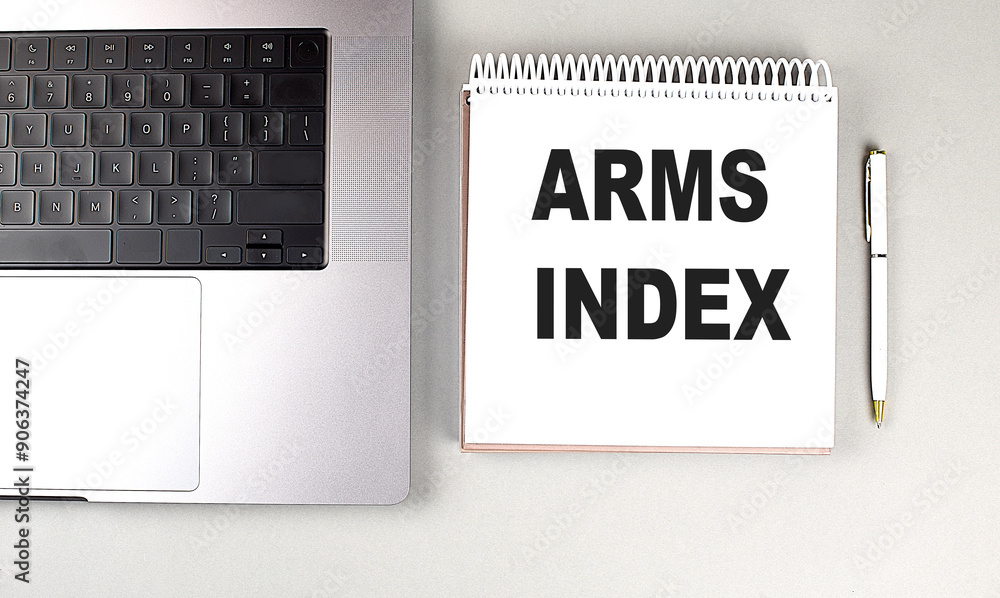 Poster arms index text on notebook with laptop, mouse and pen