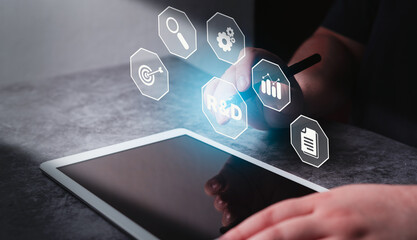 Woman use digital tablet pointing virtual interface of Research and Development. R and D to remine...