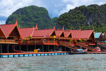 Fototapeta premium View of Koh Panyee island fishing village Nga, Thailand Phuket, on a sunny day. Traditional Thai houses.