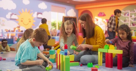 Creative Multiethnic Friends Playing Fun Games in Kindergarten. International Boys and Girls Constructing a House Out of Colorful Building Blocks. Teacher Educating Children in Modern Daycare Center - Powered by Adobe