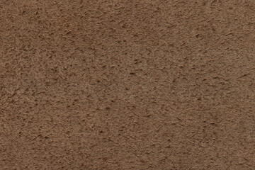 Genuine suede, brown color. Background or texture sample. Studio shot.