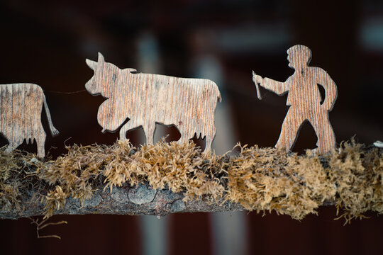 Rustic wooden figures depicting Swiss winter scene
