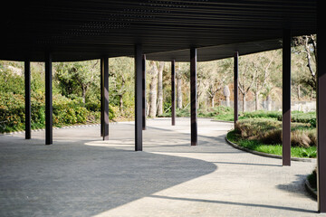 Modern architecture in spring garden, wooden canopy