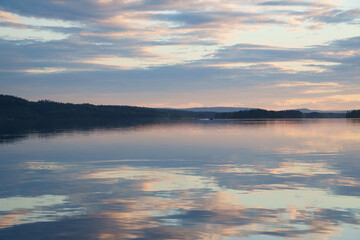 Midnight sun during midsummer time in northern swedish Vilhelmina, Swedish Lapland. Lake Volgsjön...