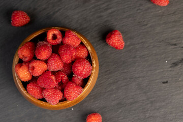 homemade harvest of ripe and healthy raspberries for food