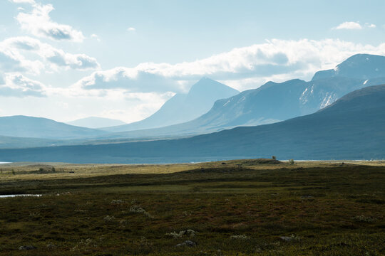 Padjelanta National Park in swedish lapland. On a hiking outdoor adventure. Beautiful Scenery view from nordkalottleden close to kutjaurestugan towards Nijak and Gisuris Mountain.