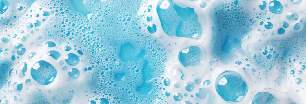 Soap foam on the water on a blue background. Foam texture as background for image. Soap bubbles on the background of foam