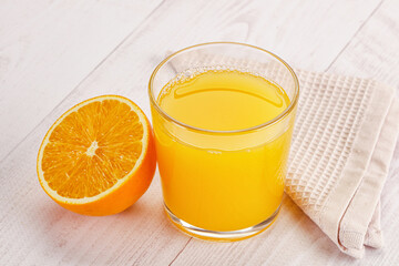 Sweet fresh orange juice in the glass