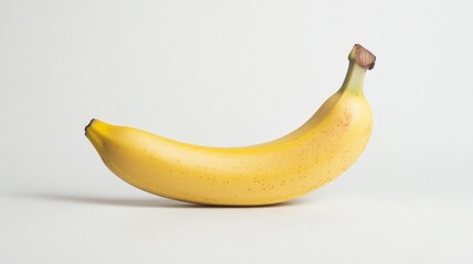 Single banana with perfect yellow skin isolated on white background, full depth of field