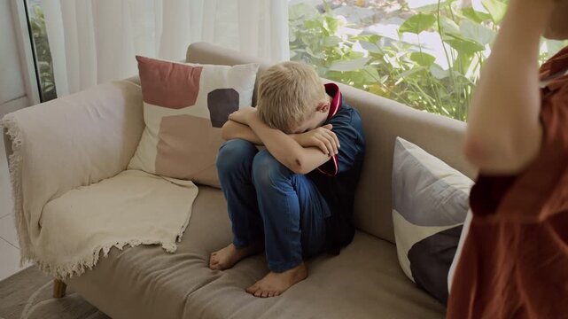 Emotional mother arguing with her teenage son of Caucasian ethnicity because of his bad behavior at home
