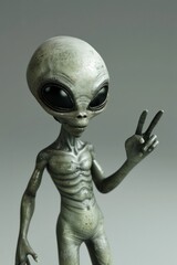 Alien is standing and waving hand, long fingers