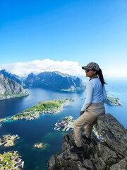 Naklejka premium Captivating Hike Overlooking Lofoten Islands in Norway Under a Clear Blue Sky