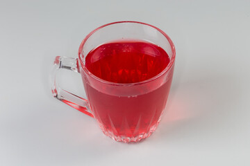 Cold drink from boiled fruits and berries in glass cup