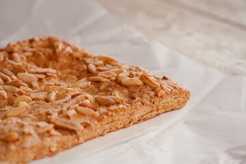 Coca de pine nuts y puff pastry of San Juan.
