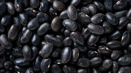 Obraz premium Close up of raw black turtle beans on a square food background