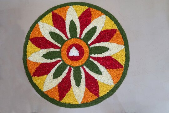 pookalam designs for onam celebrations	, pookalam made for part of onam celibration in kerala, india. it also referred to as athapookalam, is often made in a circular shape with flowers on floor