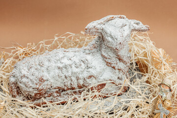 Christmas lamb cake with traditional New Year decor. Baked sweet dessert with sugar icing