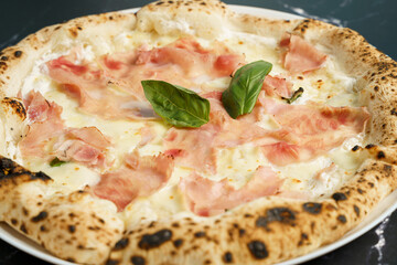 Original Italian pizza with cheese and prosciutto