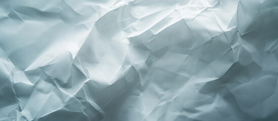 Obraz premium Textured white crumpled paper uneven soft wrinkles across the surface