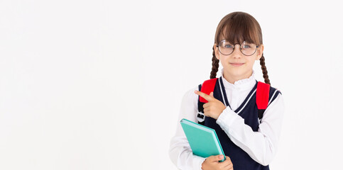 Cutout image of smart caucasian schoolgirl teenager student pupil pointing at copy space with notepad, homework, social media posting isolated in white background