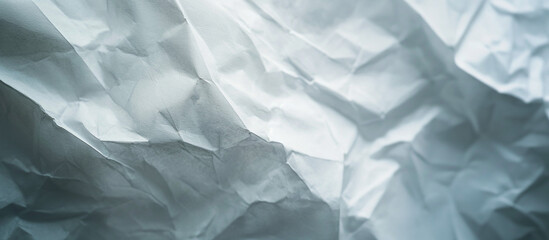 Obraz premium Textured white crumpled paper uneven soft wrinkles across the surfac