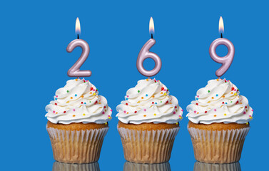 Birthday Cupcakes With Candles Lit Forming The Number 269