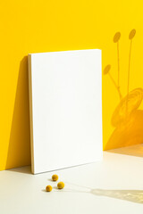 White blank magazine cover mockup leaning to yellow background