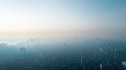 Fototapeta premium Aerial view of a city skyline enveloped in morning mist, creating an ethereal atmosphere of tranquility and urban beauty.