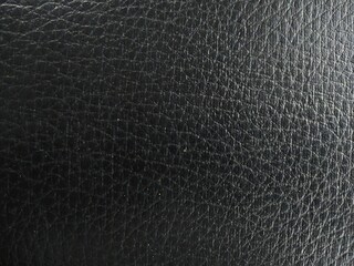 Black textured motorcycle seat leather is suitable for background