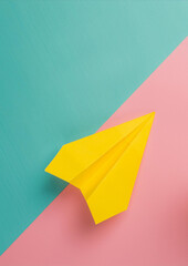 Yellow paper plane on a pink background