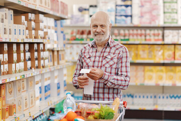 Happy customer checking a grocery receipt