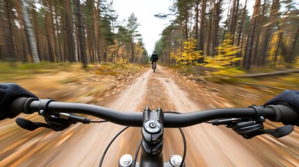 A cyclist rides on a forest trail surrounded by stunning autumn foliage as the sun sets, casting warm golden light through the trees