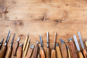 Wood carving tools. Carpentry workshop desk for joinery and woodworking top view.