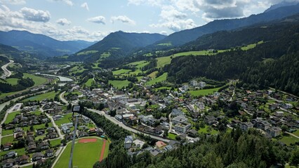 stunning high view of town beside thew river and mountains
