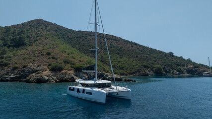 The beauty of a catamaran cruising, seen from above.