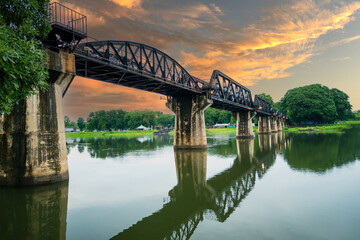 Fototapeta premium Beautiful landscape of Bridge River Kwai at Kanchanaburi, Thailand in morning time. Is a famous place and a tourist destination