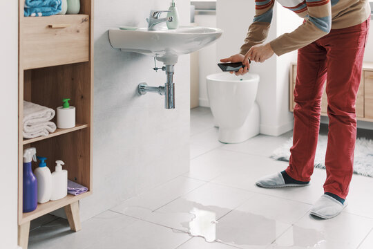 Man calling a professional plumber