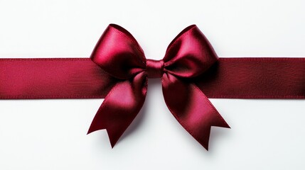 Fototapeta premium a red satin ribbon with a bow on white background