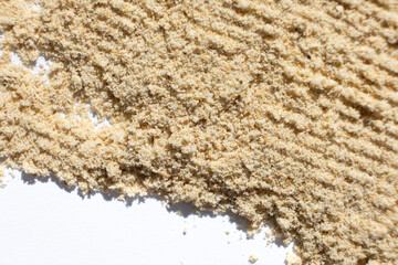 Abstract beige ground ginger background. Creativity in cooking.