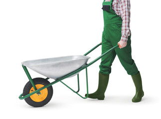 Happy gardener posing with a wheelbarrow