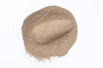 Ground black pepper texture on white background, top view.