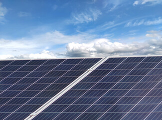Photovoltaic or solar panels. Sky background. Concept using green and clean energy for environment. Renewable energy, Natural power from sunlight to generate electricity. Sustainable energy.
