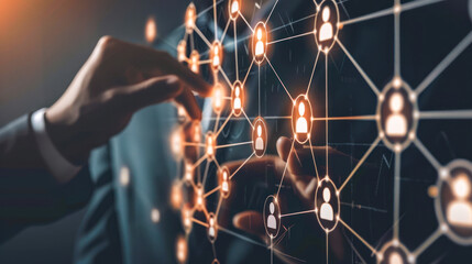 Networking, HR. A hand is touching a screen with a network map and people on it. Concept of social connections and the importance of human interaction and technological reach, business analysis