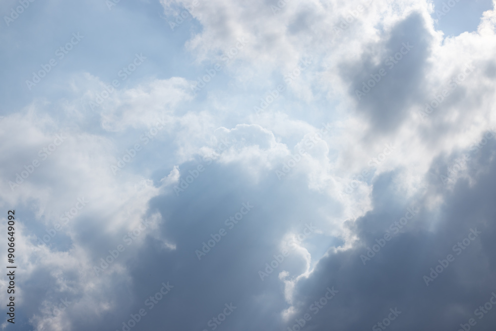 Wall mural the sky is cloudy and the sun is shining through the clouds