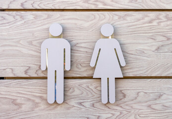 Toilet icon, public toilet signs, toilet sign in the form of a man and woman figure on a wooden...