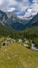 Aerial view of Val di Mello, a green valley surrounded by granite mountains and woods, renamed the Italian Yosemite Valley by nature lovers. Val Masino, Valtellina, Sondrio. Italy