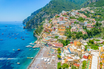 Positano town, beach and beautiful colorful houses on the cliff in Amalfi coast in Italy
