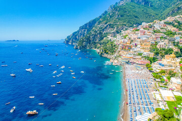 Positano town, beach and beautiful colorful houses on the cliff in Amalfi coast in Italy