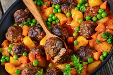 turkish meatball stew, sulu kofte, in a pan
